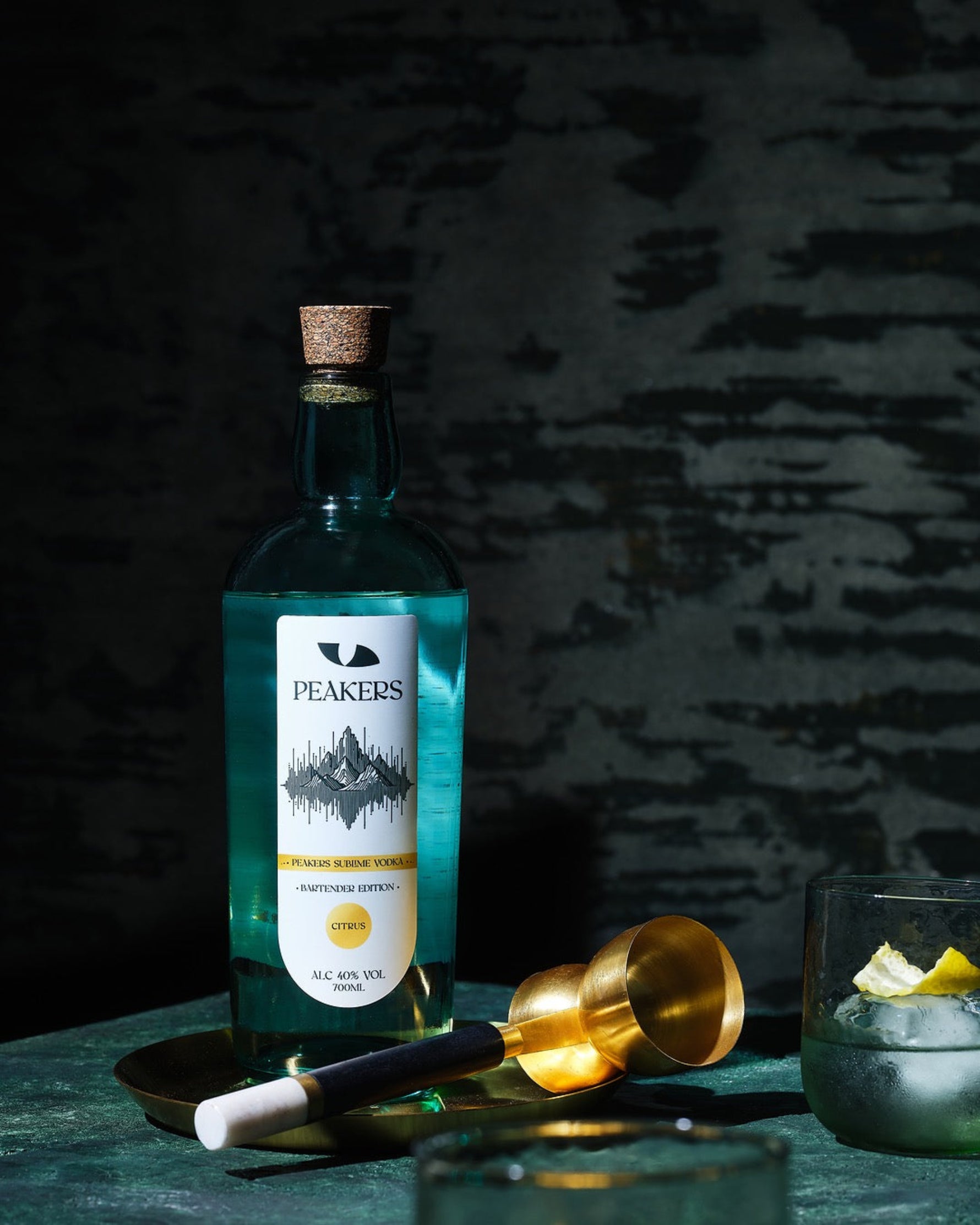 Peakers Sublime Vodka, with Jigger and Fresh Cocktail garnished with organic lemon peel.
